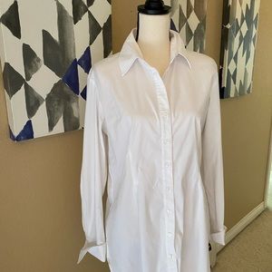 Button down classy white blouse.  Longer length